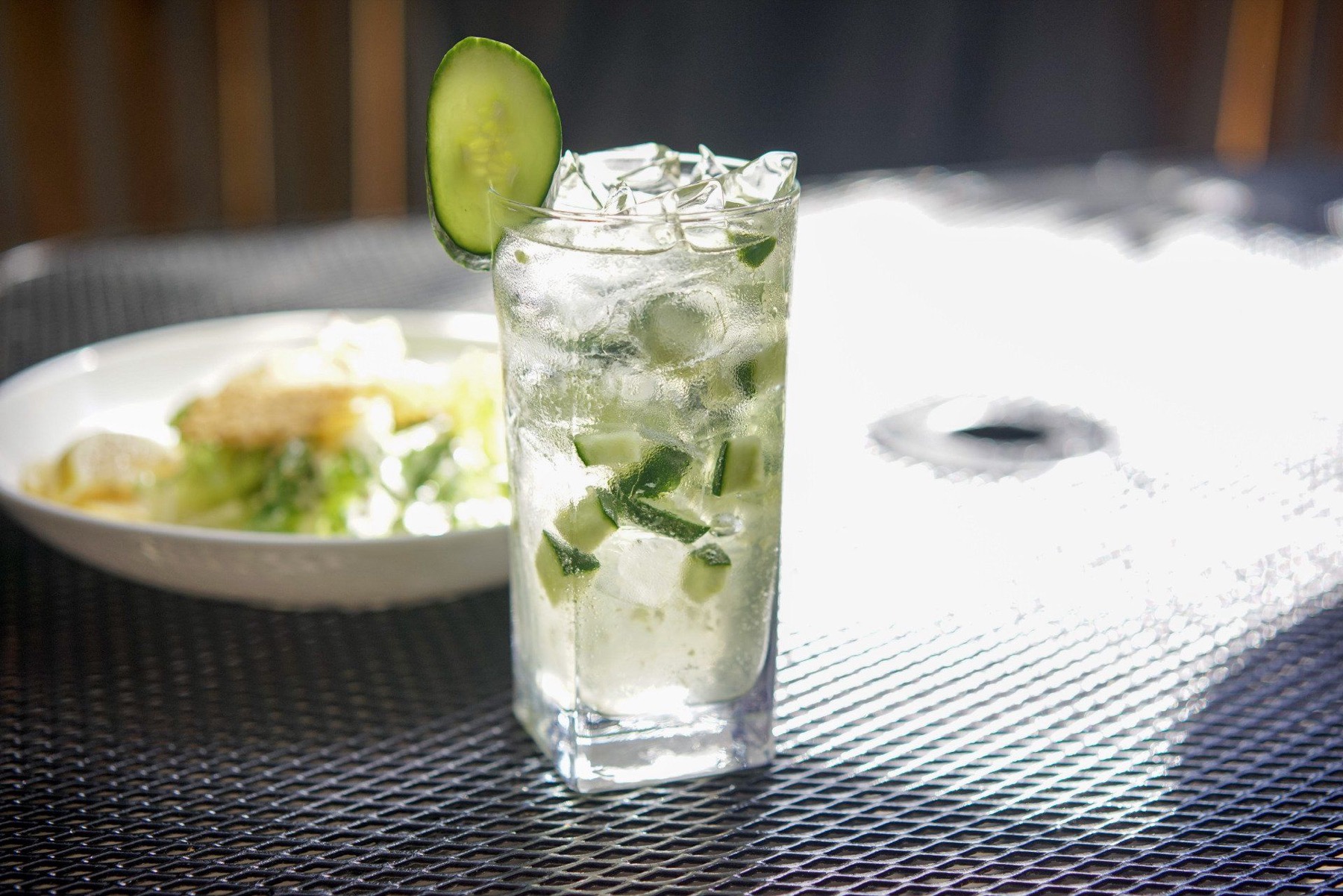 A cucumber and gin highball with ice